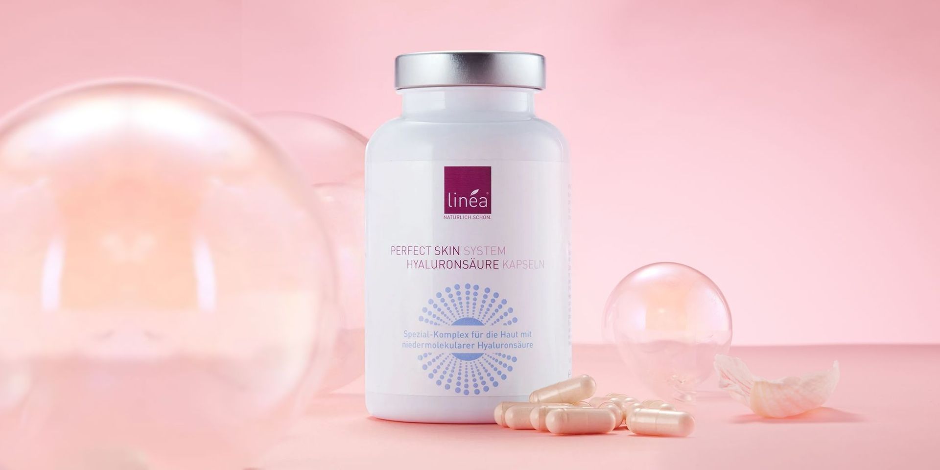 Hyaluronsäure-Kapseln von Linea für Hautpflege auf rosa Hintergrund