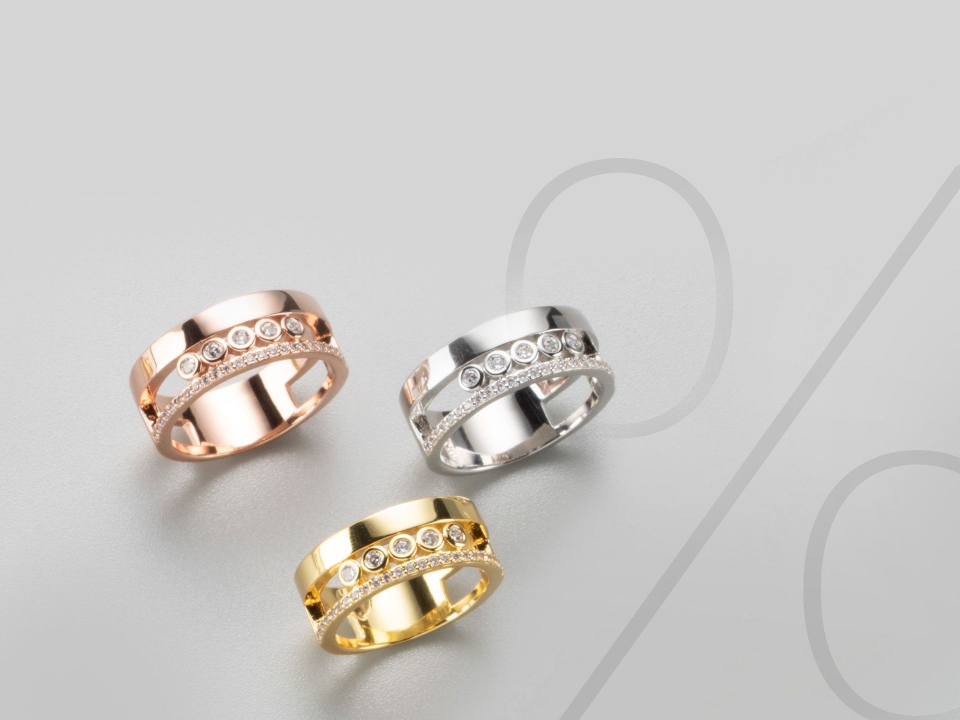 Drei Ringe auf einem grauen Hintergrund